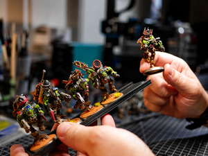 Ork miniatures with magnetised round bases locked into a Magnetrays tray