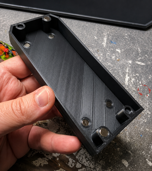 Empty 3D printed weapon options box with neodymium magnets fitted