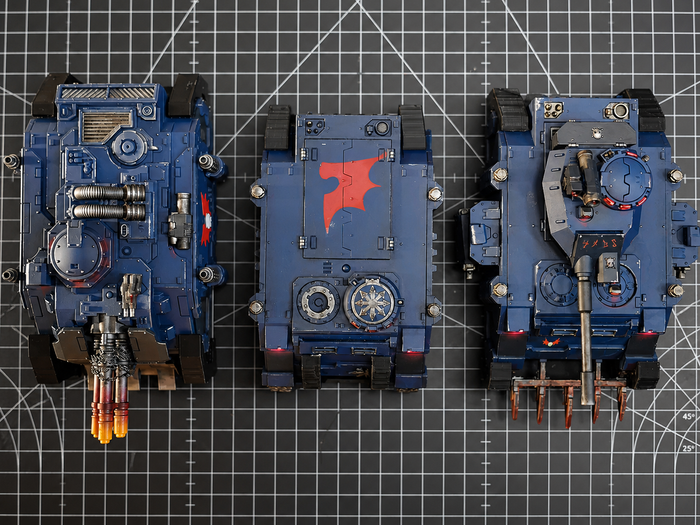 Top view of Warhammer 40k vehicle miniatures seated in Magnetic Anchors holders