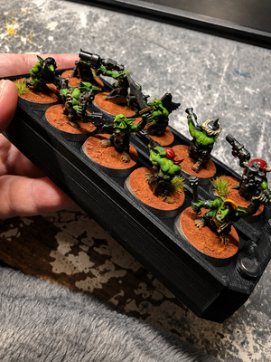 Weapon options box stacked under an infantry tray of Ork miniatures